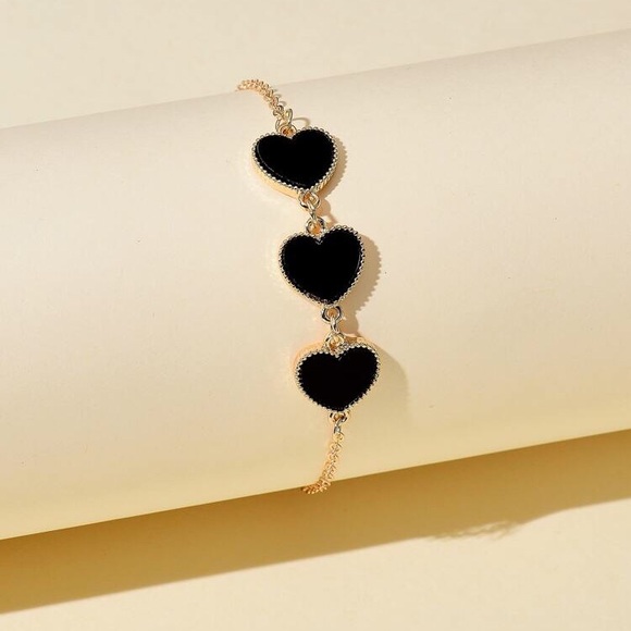 Jewelry - Gold tone bracelet with 3 hearts
